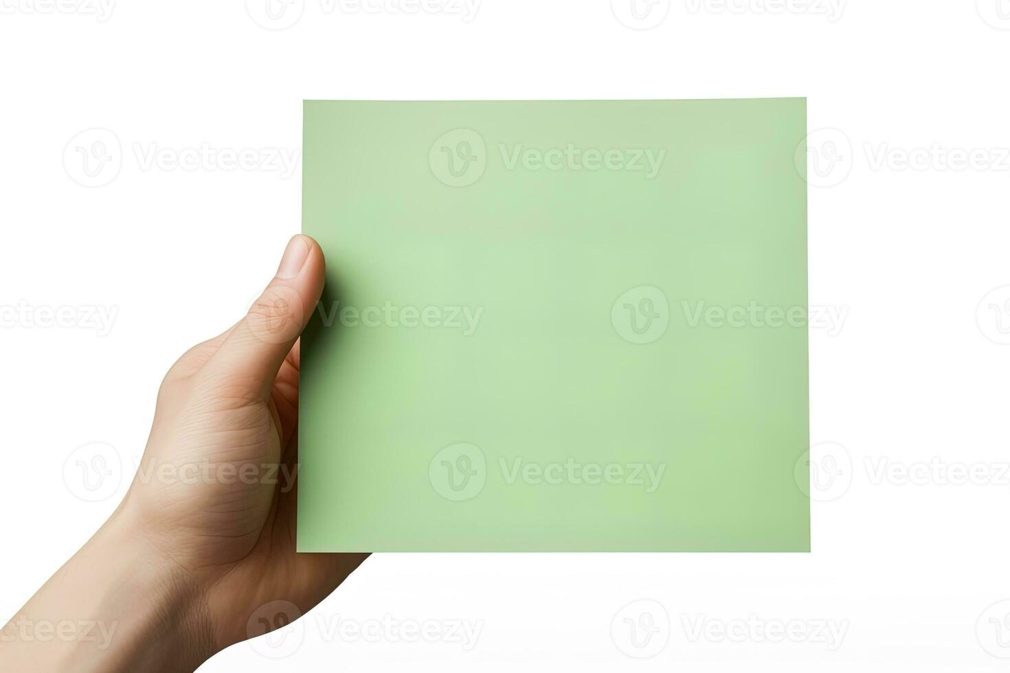 A human hand holding a blank sheet of green paper or card isolated on a white background. ai generated photo