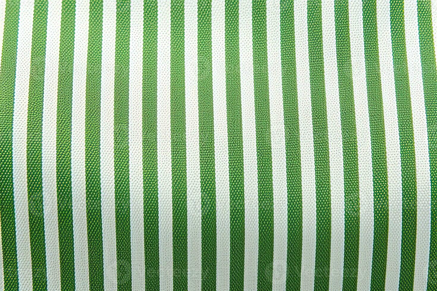verde y blanco a rayas tela textura antecedentes. ai generado foto