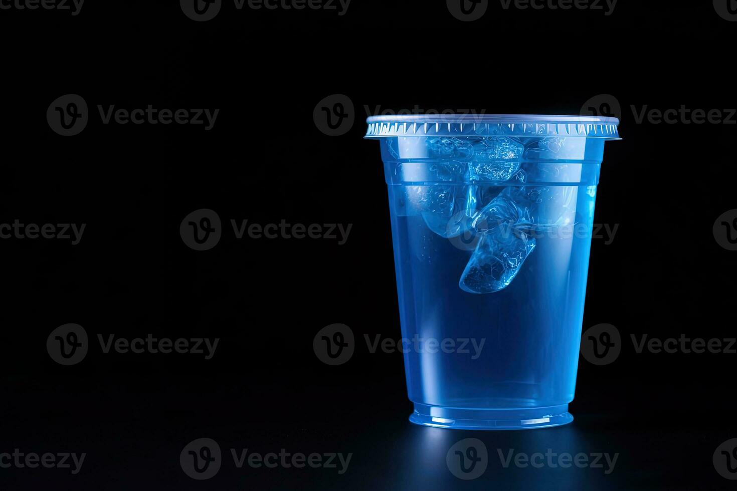 Blue drink in a plastic cup isolated on a black background. Take away drinks concept with copy space. ai generated photo