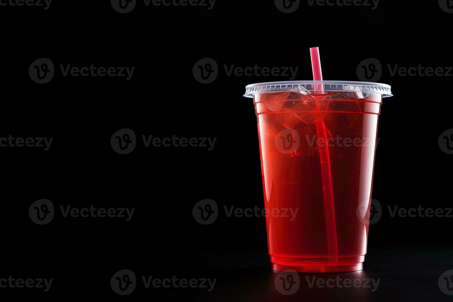 Red drink in a plastic cup isolated on a black background. Take away drinks concept with copy space. ai generated photo