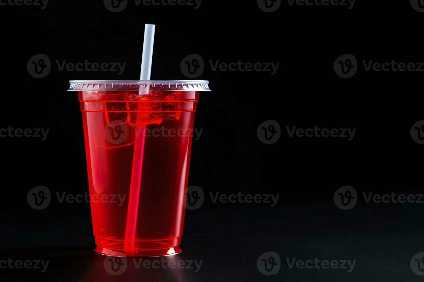 Red drink in a plastic cup isolated on a black background. Take away drinks concept with copy space. ai generated photo