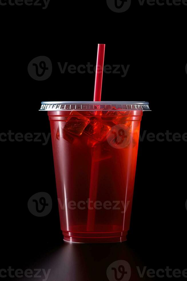 Red drink in a plastic cup isolated on a black background. Take away drinks concept. ai generated photo