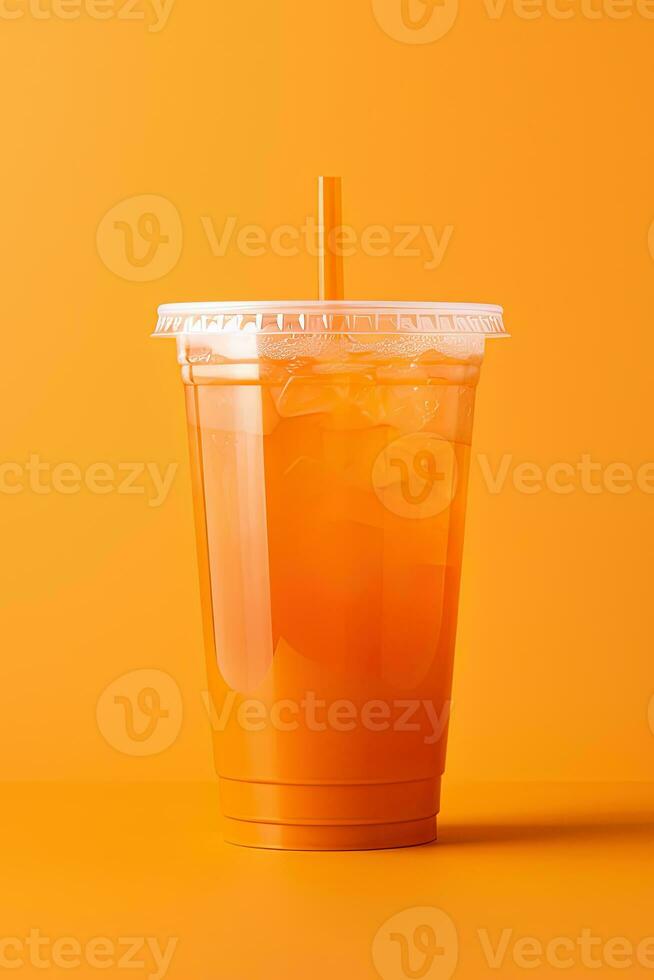 Orange color drink in a plastic cup isolated on a orange color background. Take away drinks concept. ai generated photo