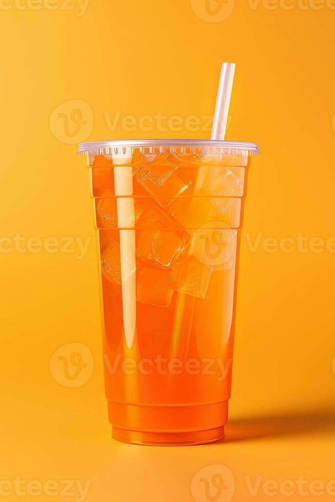 Orange color drink in a plastic cup isolated on a orange color background. Take away drinks concept. ai generated photo