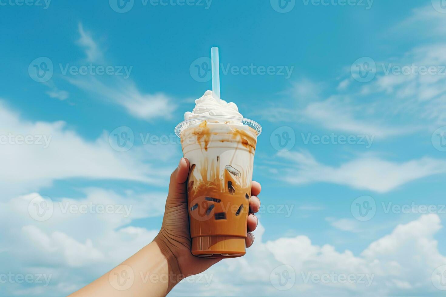 Hand holding iced coffee in a plastic cup with a blue sky and cloud background. ai generated photo
