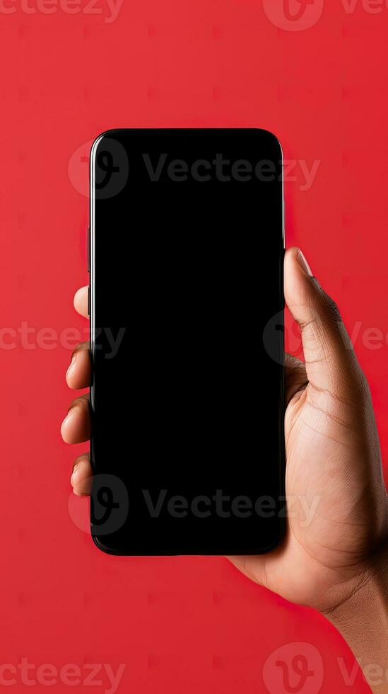 Hand holding smartphone with a black blank screen isolated on a red background. ai generated photo