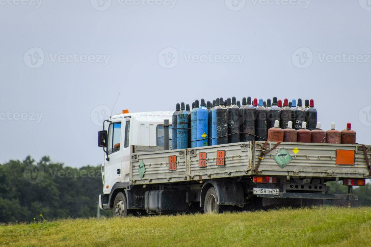 Transportation of dangerous goods. Cylinders with propane and oxygen in the truck. photo