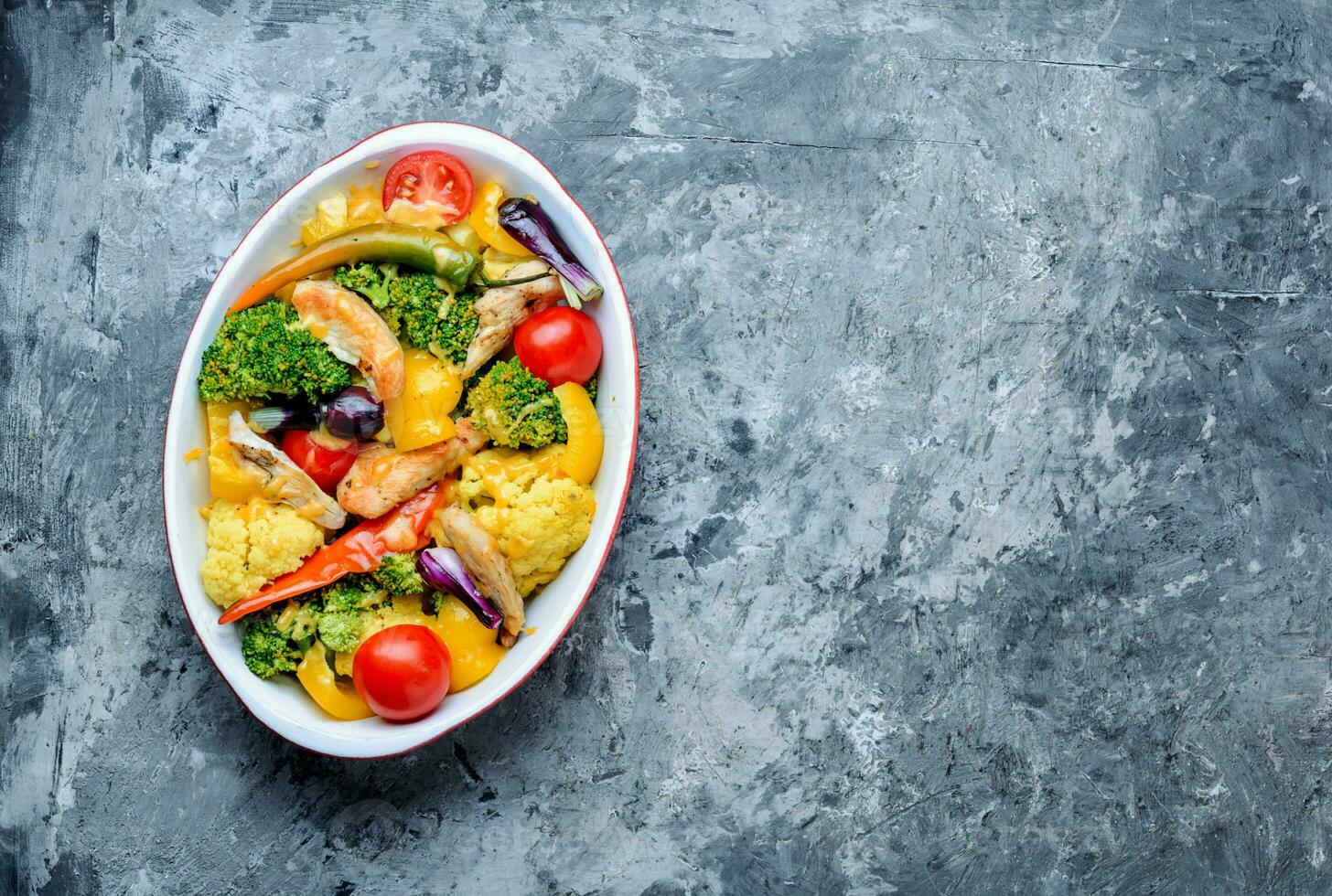 Baked vegetables with chicken breast photo