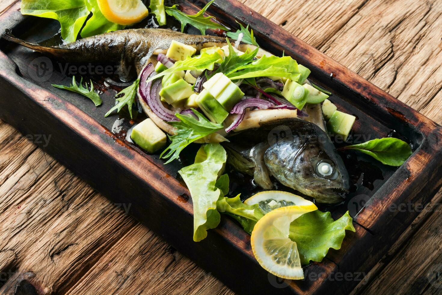 Baked fish with avocado photo