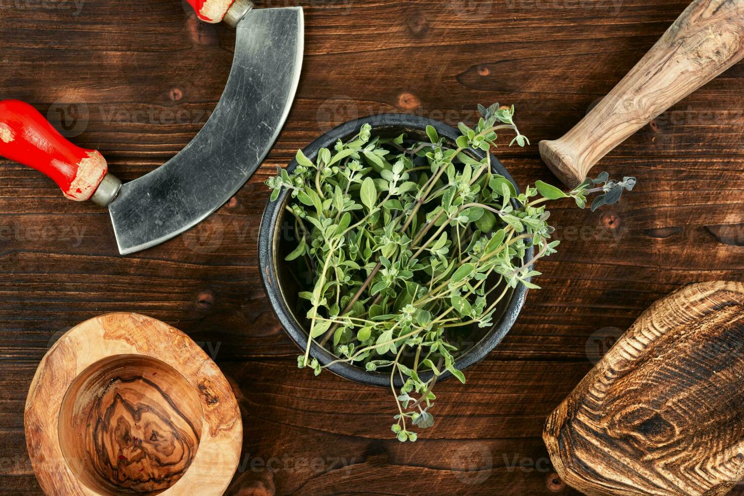 Raw sprig of marjoram, spice on old table. photo