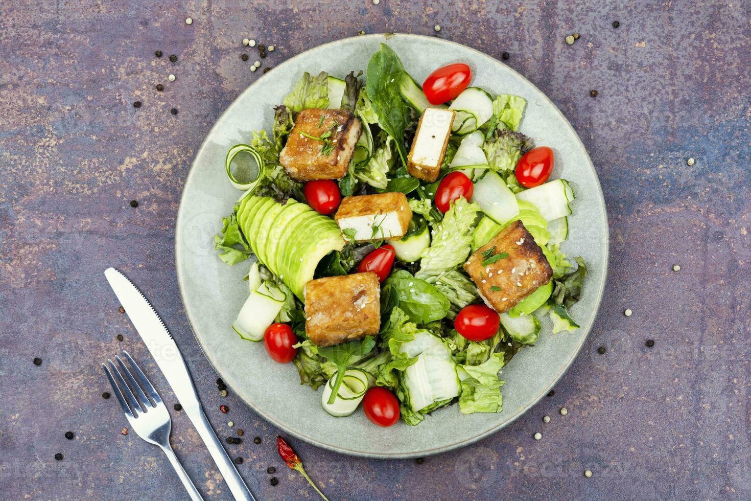 Salad with fresh vegetables and tofu. photo