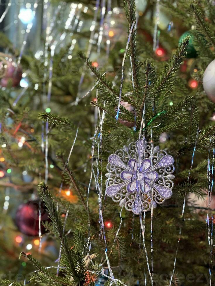 Christmas tree decorated with toys and lights photo