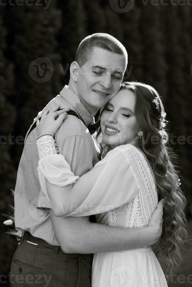 wedding walk of the bride and groom in a coniferous photo