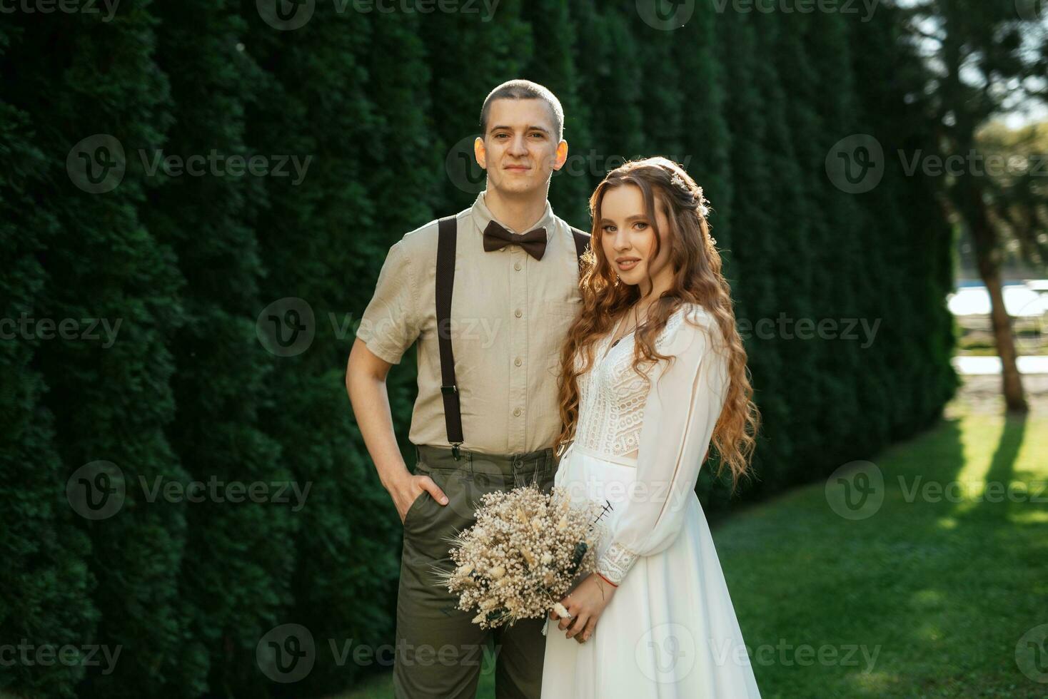 wedding walk of the bride and groom in a coniferous photo