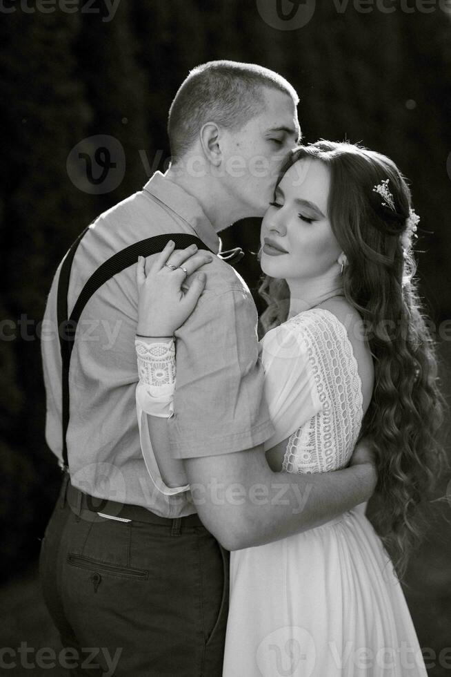 wedding walk of the bride and groom in a coniferous photo