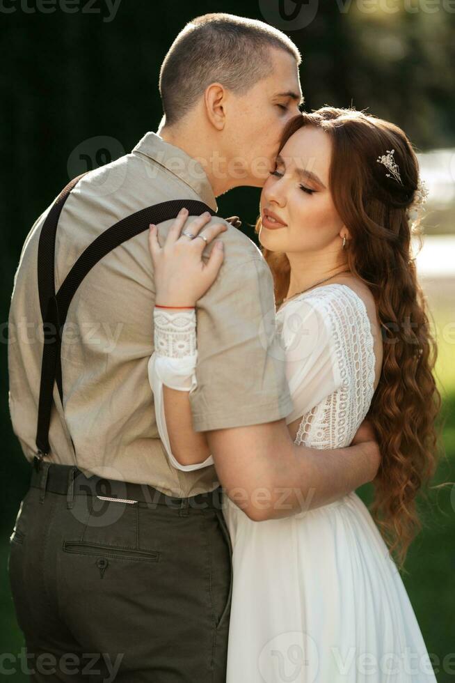 wedding walk of the bride and groom in a coniferous photo