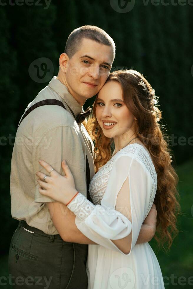 wedding walk of the bride and groom in a coniferous photo