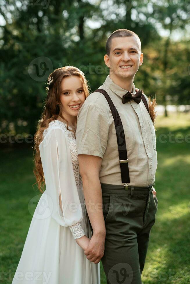 wedding walk of the bride and groom in a coniferous photo