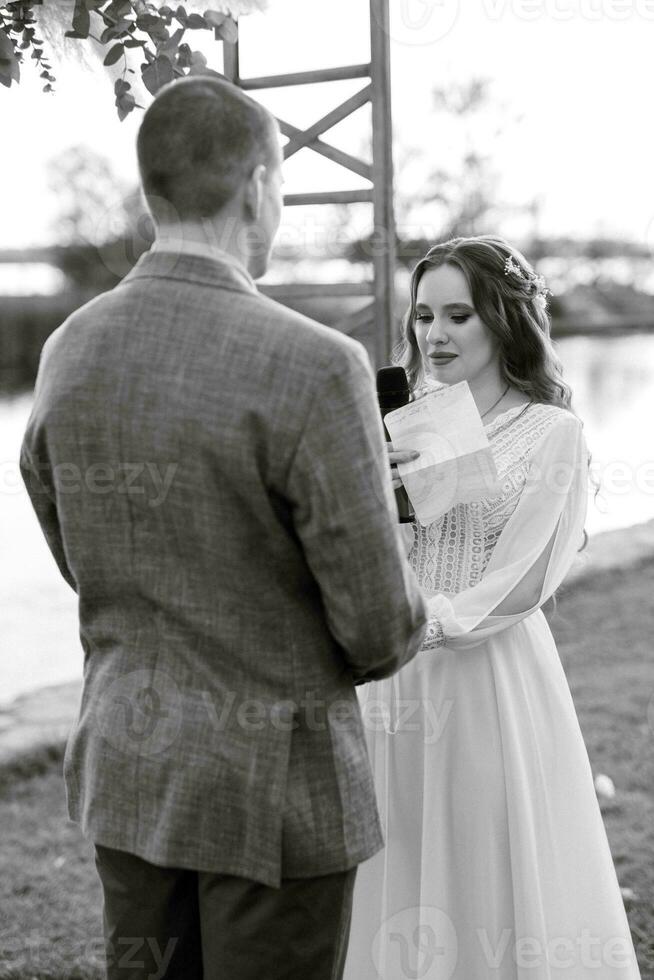 wedding ceremony of the newlyweds in a country cottage photo