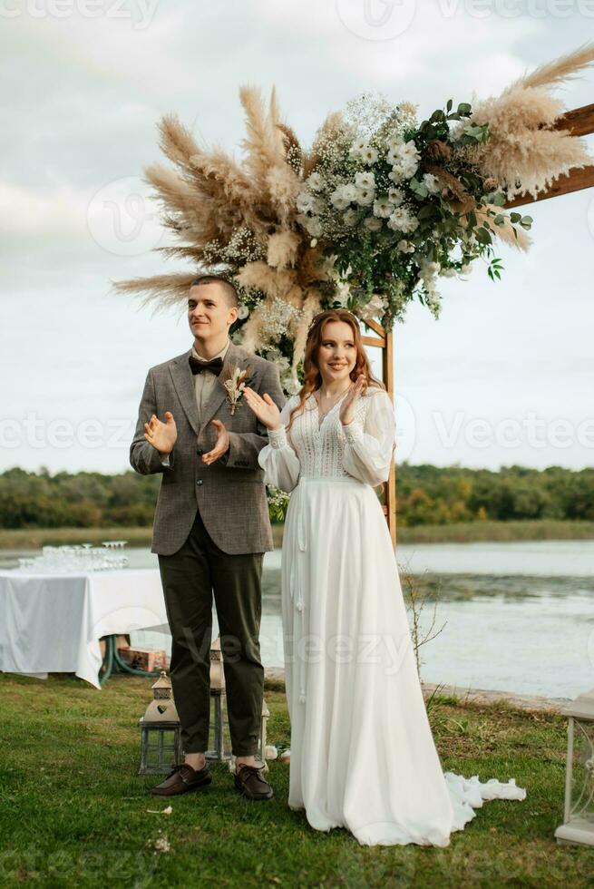 wedding ceremony of the newlyweds in a country cottage photo