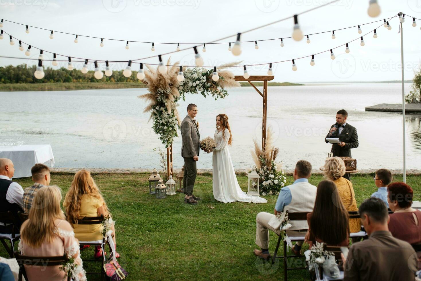 wedding ceremony of the newlyweds in a country cottage photo