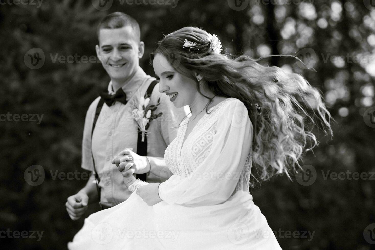 wedding walk of the bride and groom in a coniferous photo