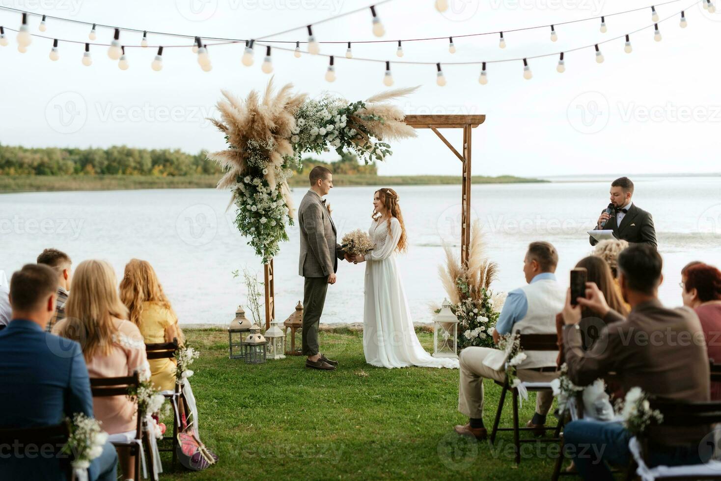 wedding ceremony of the newlyweds in a country cottage photo