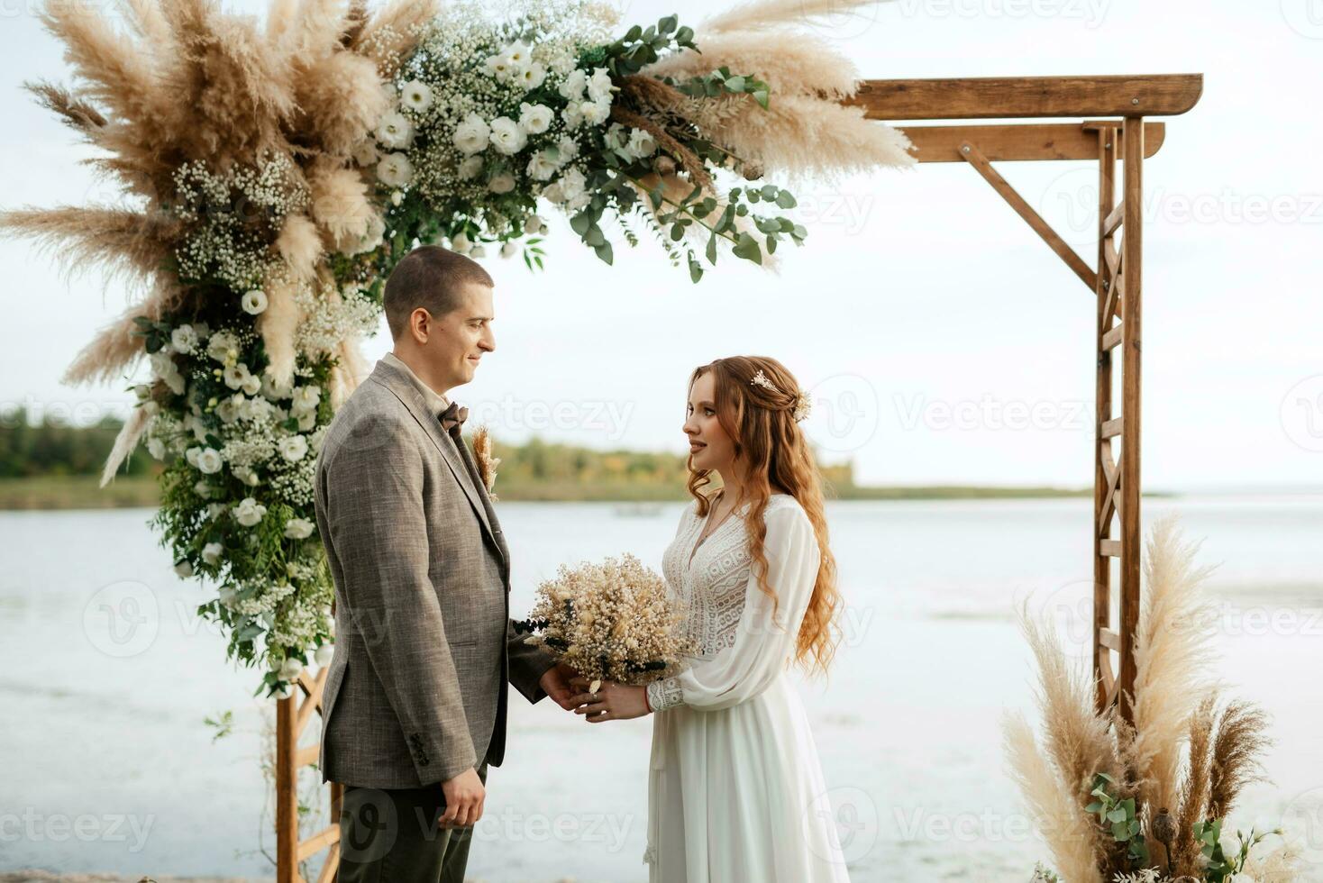 wedding ceremony of the newlyweds in a country cottage photo