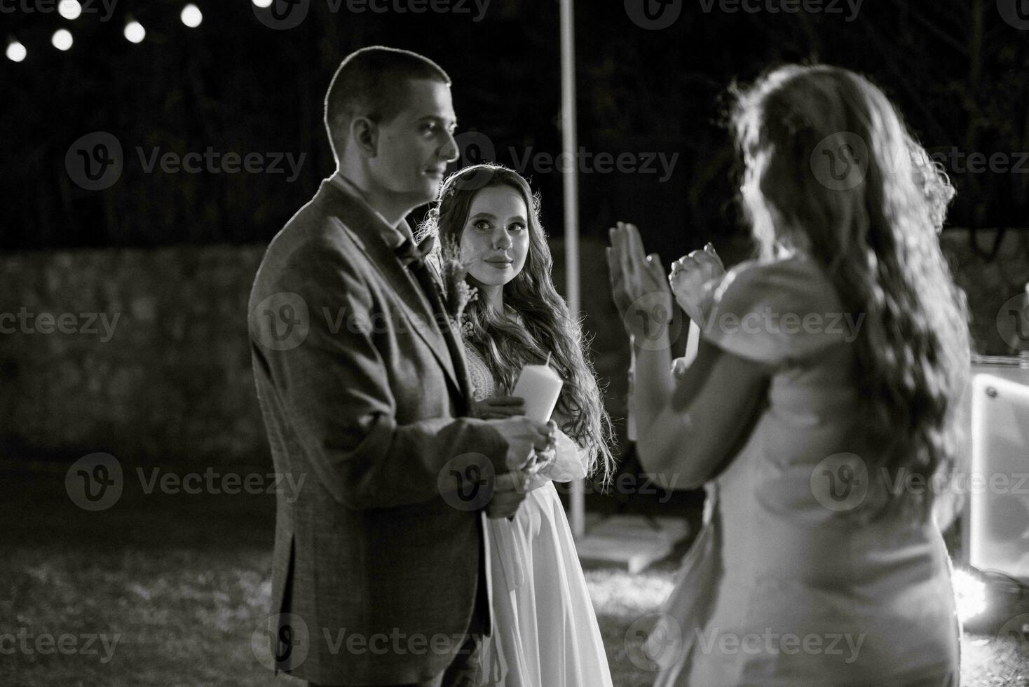 transfer of wedding fire with the help of candles the newlyweds photo