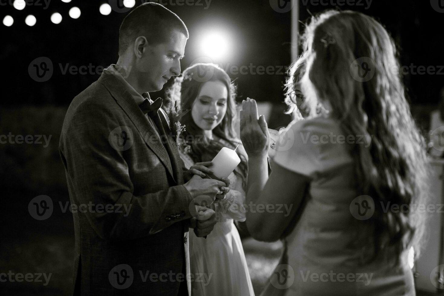 transfer of wedding fire with the help of candles the newlyweds photo