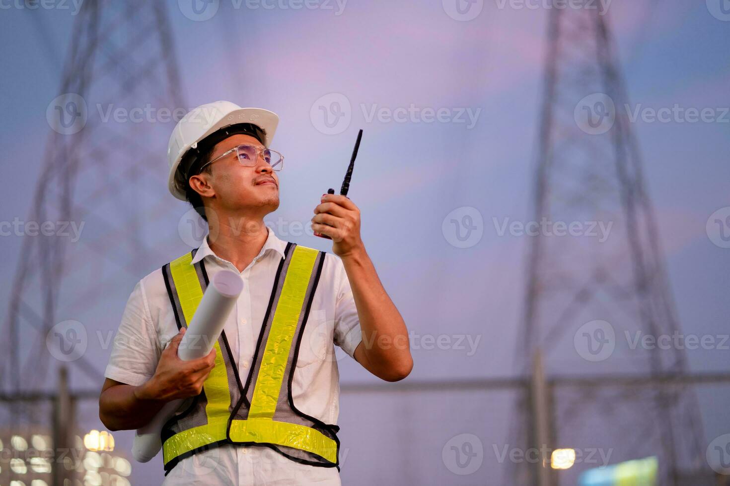 Engineer standing at power station watching power generation planning work at high voltage pole, electrical engineer power station photo