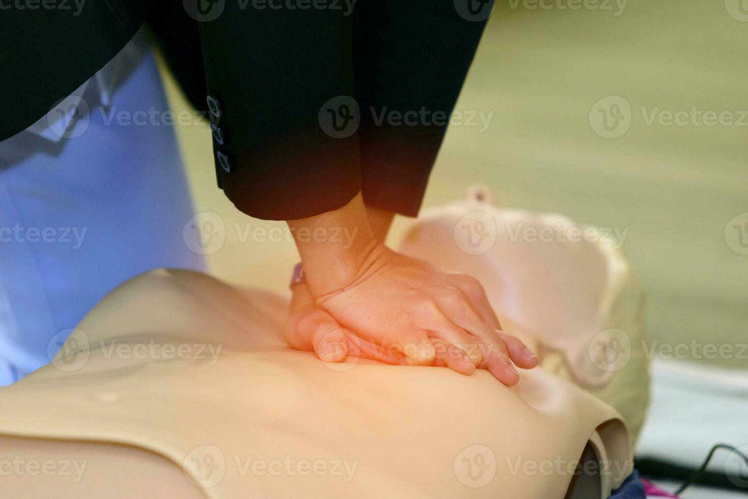 CPR First Aid Training with CPR dummy in the class photo