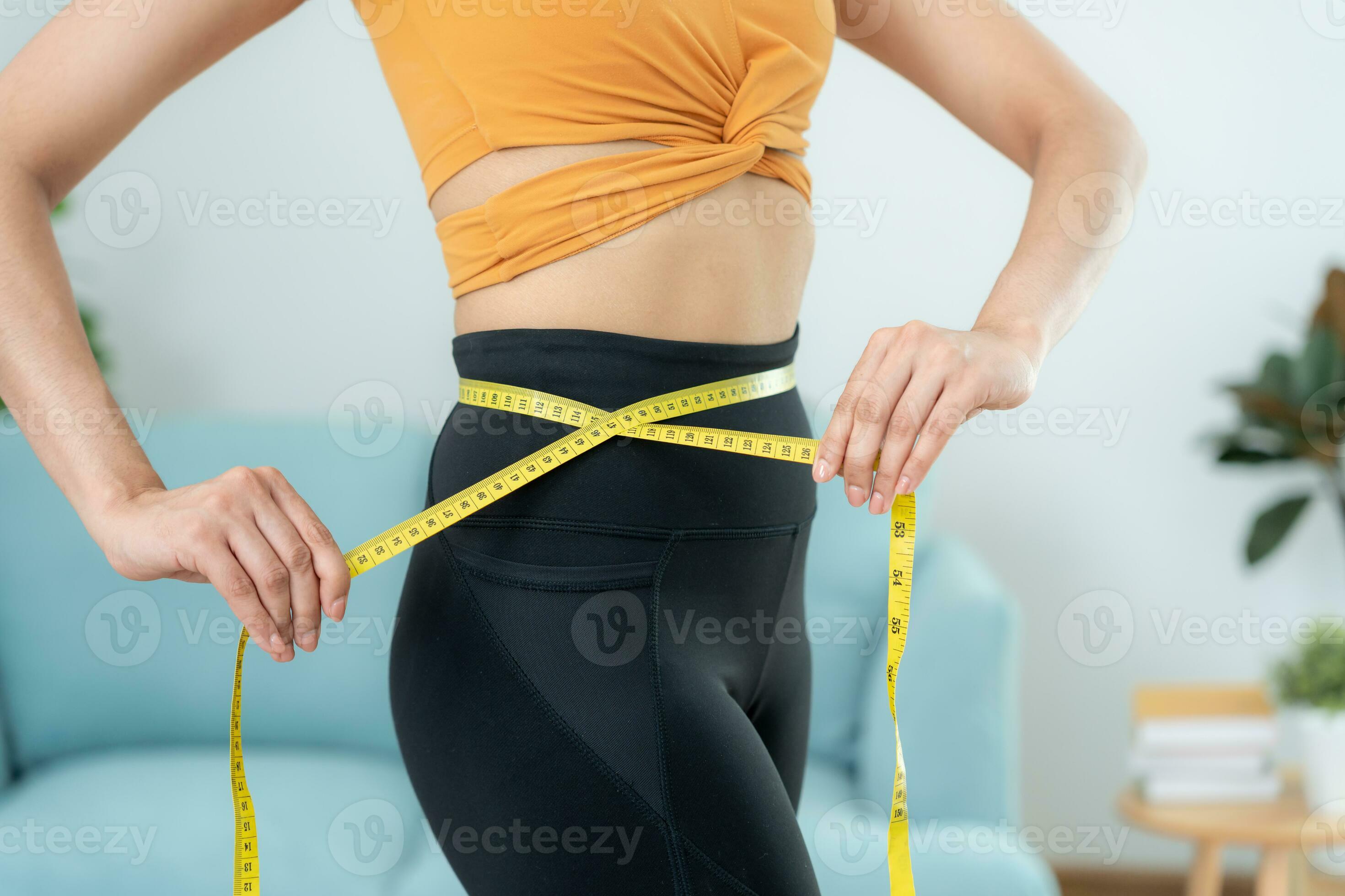Diet and dieting. Beauty slim female body use tape measure. Woman in  exercise clothes achieves weight loss goal for healthy life, crazy about  thinness, thin waist, nutritionist. 30577331 Stock Photo at Vecteezy