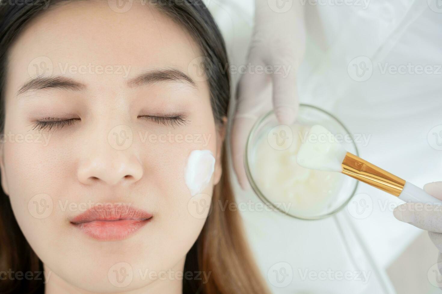 Beautiful woman receive spa and treatment skin of face. face of a healthy woman apply cream. Advertisement for skin cream, anti-wrinkle, baby face, whitening, moisturizer, tighten pores serum photo