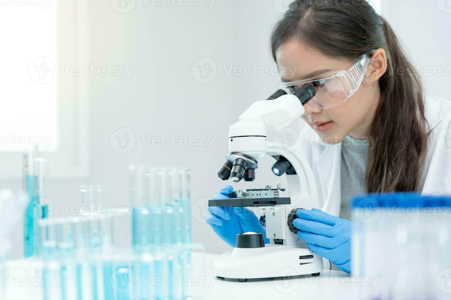 Scientist analyze biochemical samples in advanced scientific laboratory. Medical professional use microscope look microbiological developmental of viral. Biotechnology research in science lab. photo