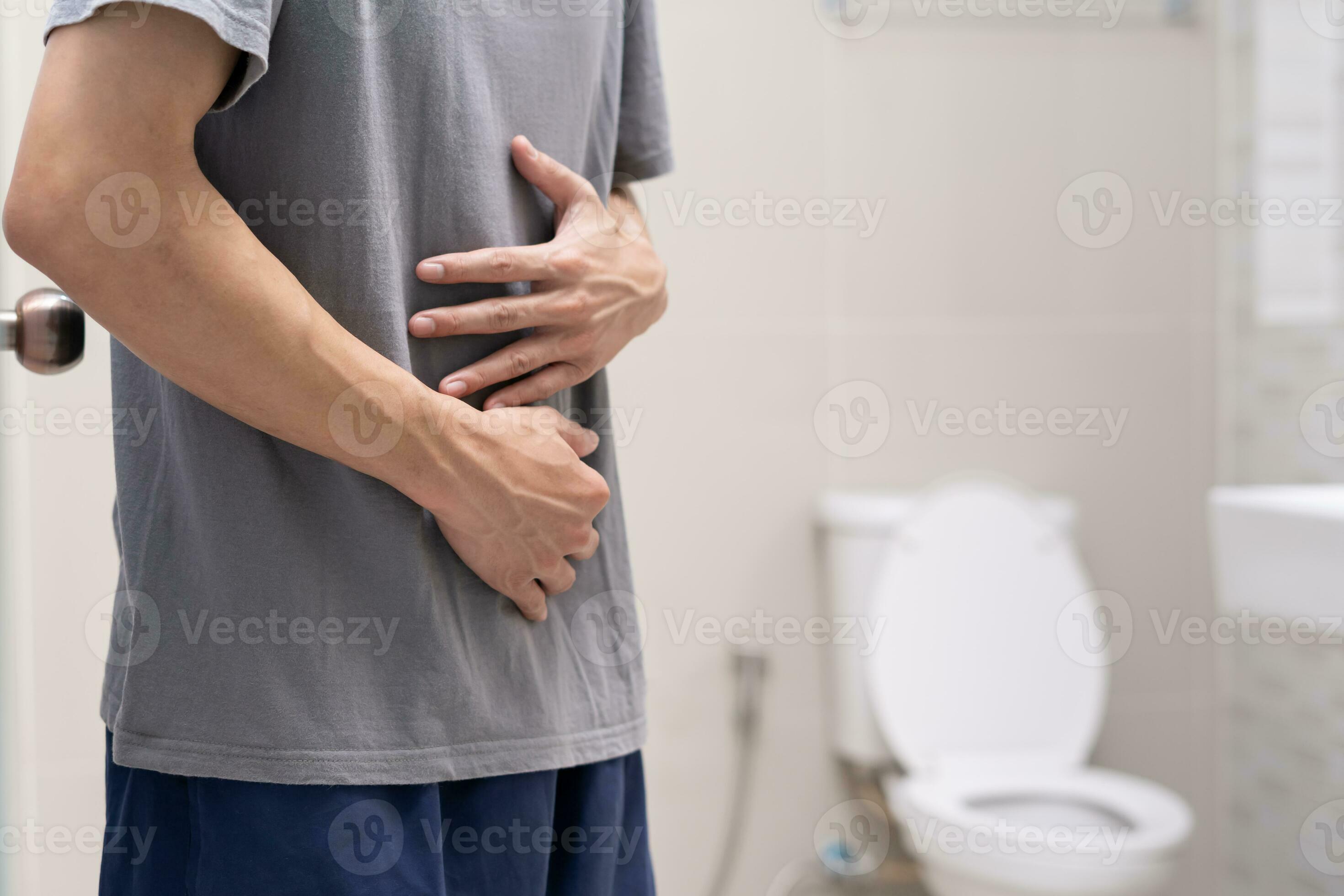 Constipation and diarrhea in bathroom. Hurt man touch belly stomach