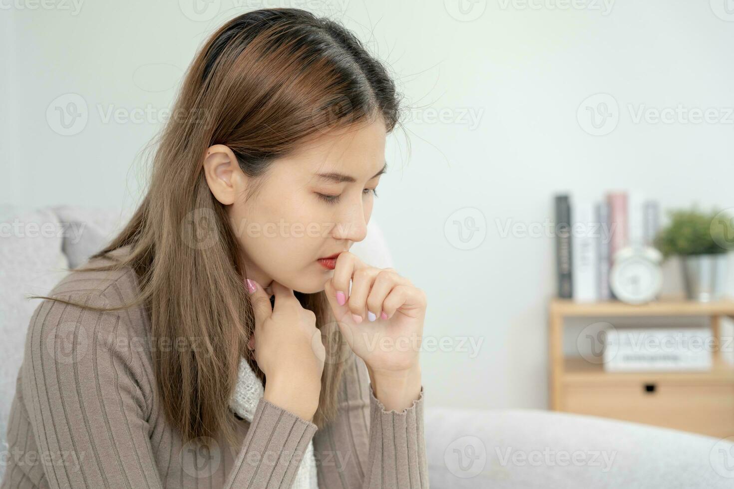 sick woman with a headache and feeling cold on sofa, female sneezing and runny nose with seasonal influenza, allergic, high fever and influenza, resting, virus, coronavirus, feel illness, respiratory photo