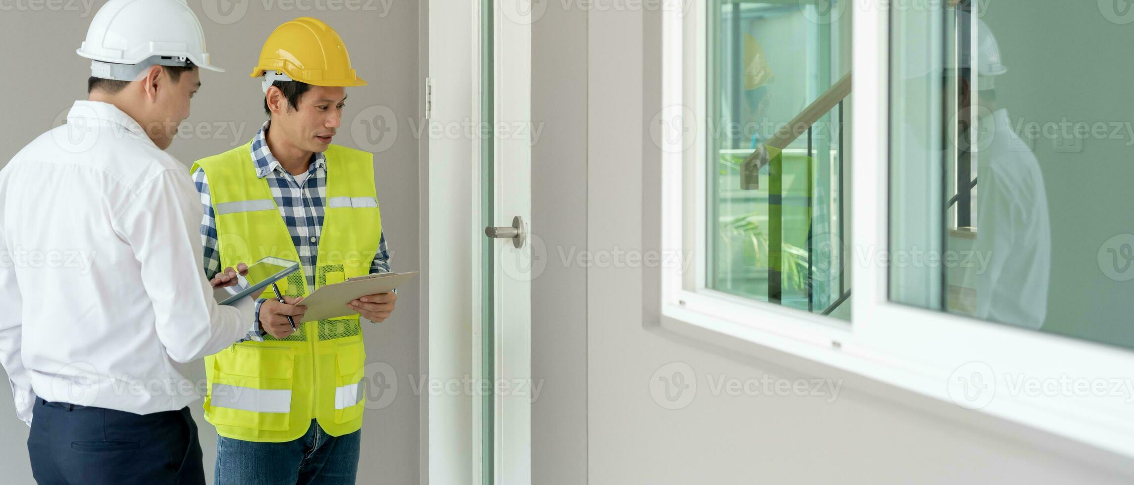 inspector engineer and owner project is inspecting construction and quality assurance new house. Engineers or architects or contactor work to build the house before handing it over to the homeowner photo