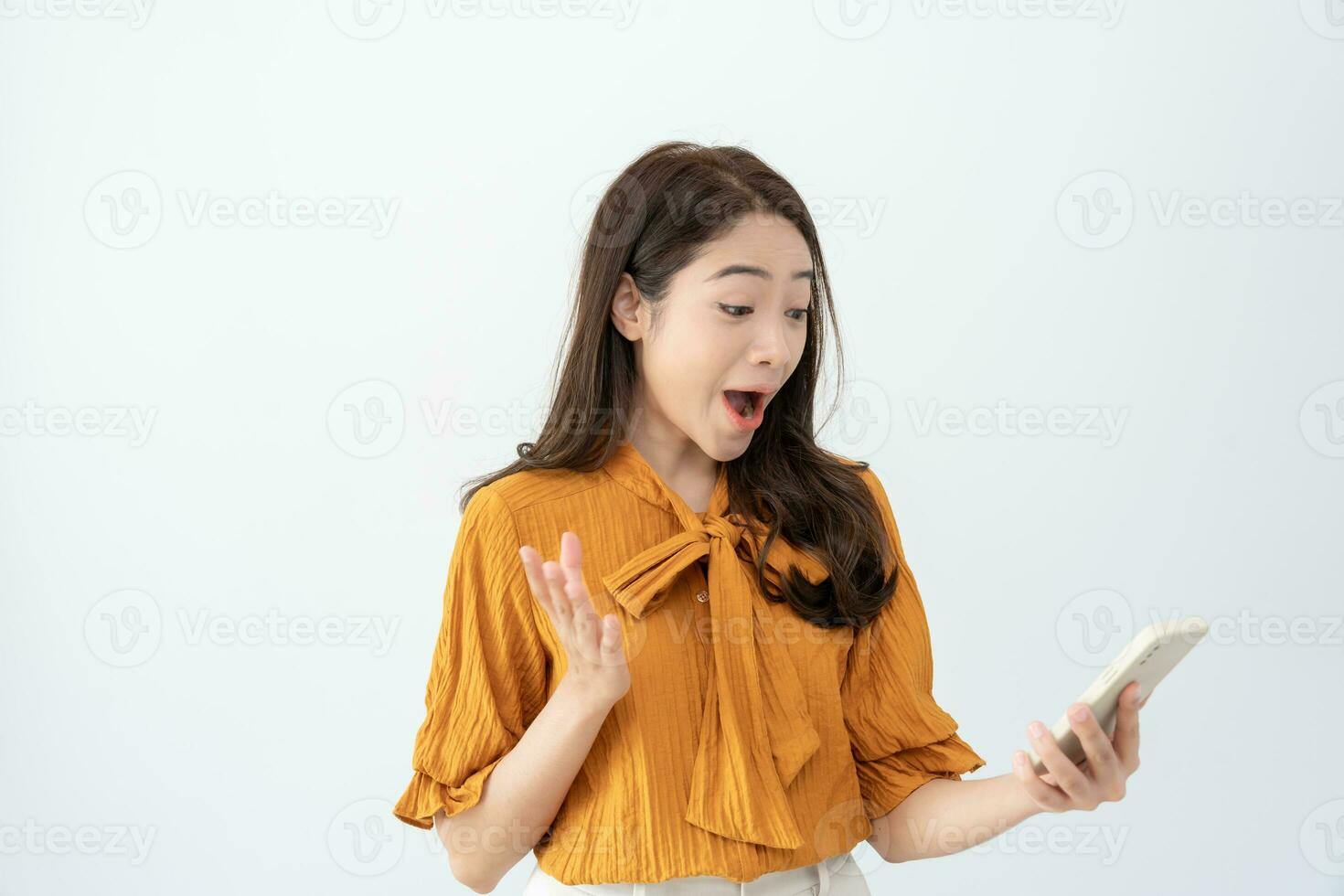 Asian beautiful woman exited surprise face expression . female feels shocked with the phone. exciting smile and happy adorable rejoices. Very enjoy and fun relax time. wow, girl holding smartphone. photo