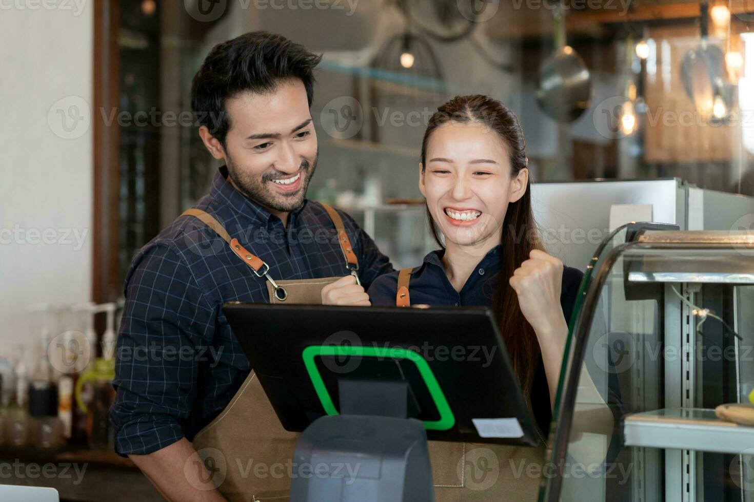 Asia couple owner happy and smile receive order from customer. guarantees safety, cleanliness, open the coffee shop. open for New normal. Small business, welcome, restaurant, home made, cafe photo