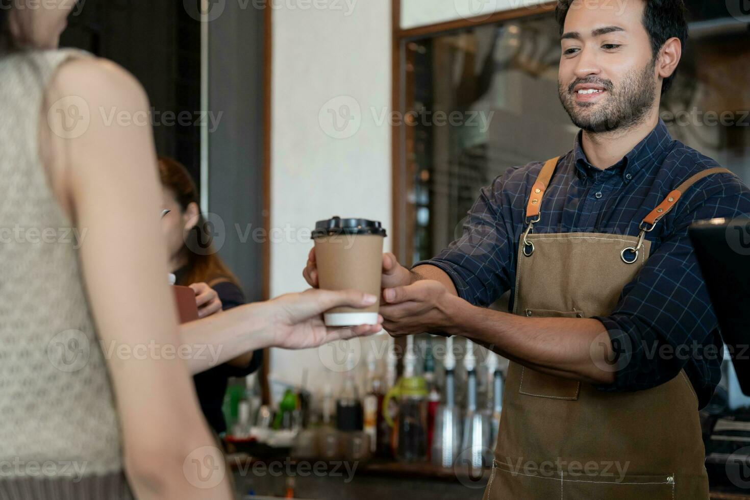 Asia man owner happy smile and send order to customer. guarantees safety, cleanliness, open the coffee shop. open for New normal. Small business, welcome, restaurant, home made, cafe photo