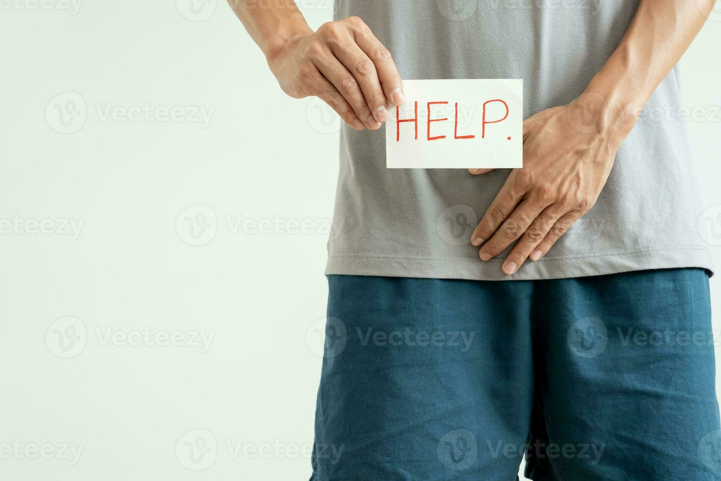 Man hold hand in front of private parts feeling discomfort from disease and inflammation. Venereal, testicular cancer. bladder problems, erectile dysfunction, premature ejaculation, prostate cancer photo