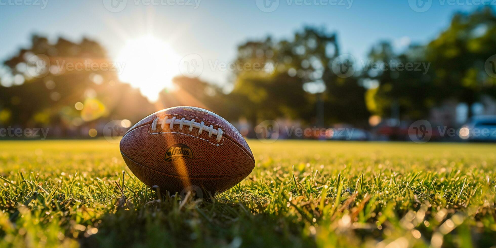 American football ball on grass field with blue sky and clouds in background AI Generated photo