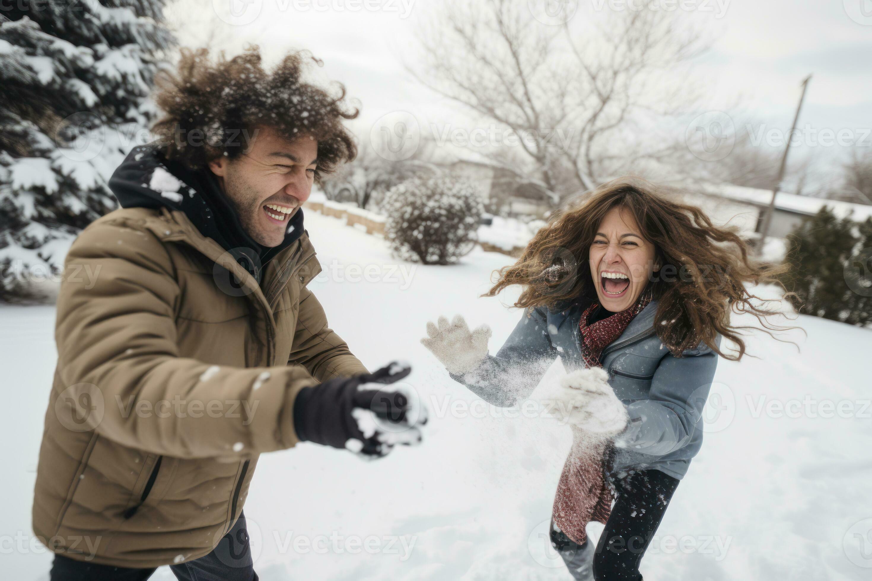 A playful couple engaged in a friendly snowball fight, capturing their  fun-loving and adventurous spirit. Generative Ai 30592674 Stock Photo at  Vecteezy