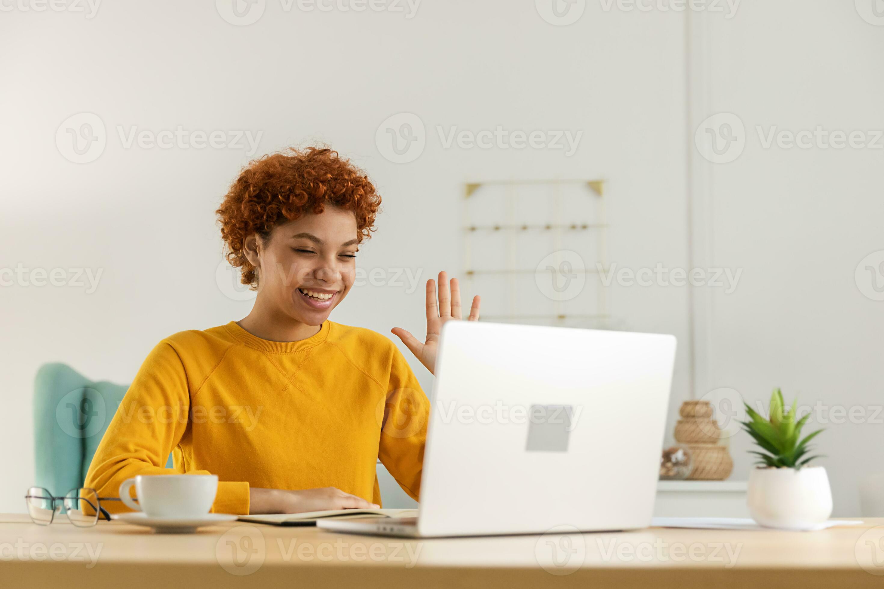 African girl friends chat online. Girl sitting in a chair in front of a  laptop and speaks with friend. Video conference, online chat concept.  Working or online meeting from home. Vector illustration.