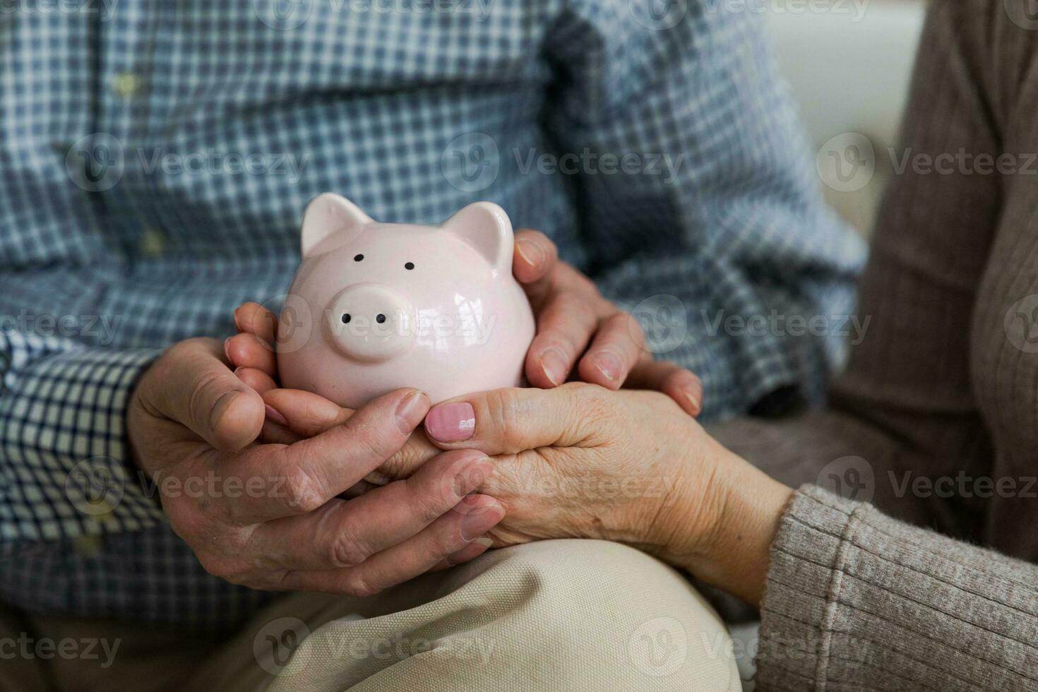 Saving money investment for future. Senior adult mature couple hands holding piggy bank with money coin. Old man woman counting saving money planning retirement budget. Investment banking concept. photo