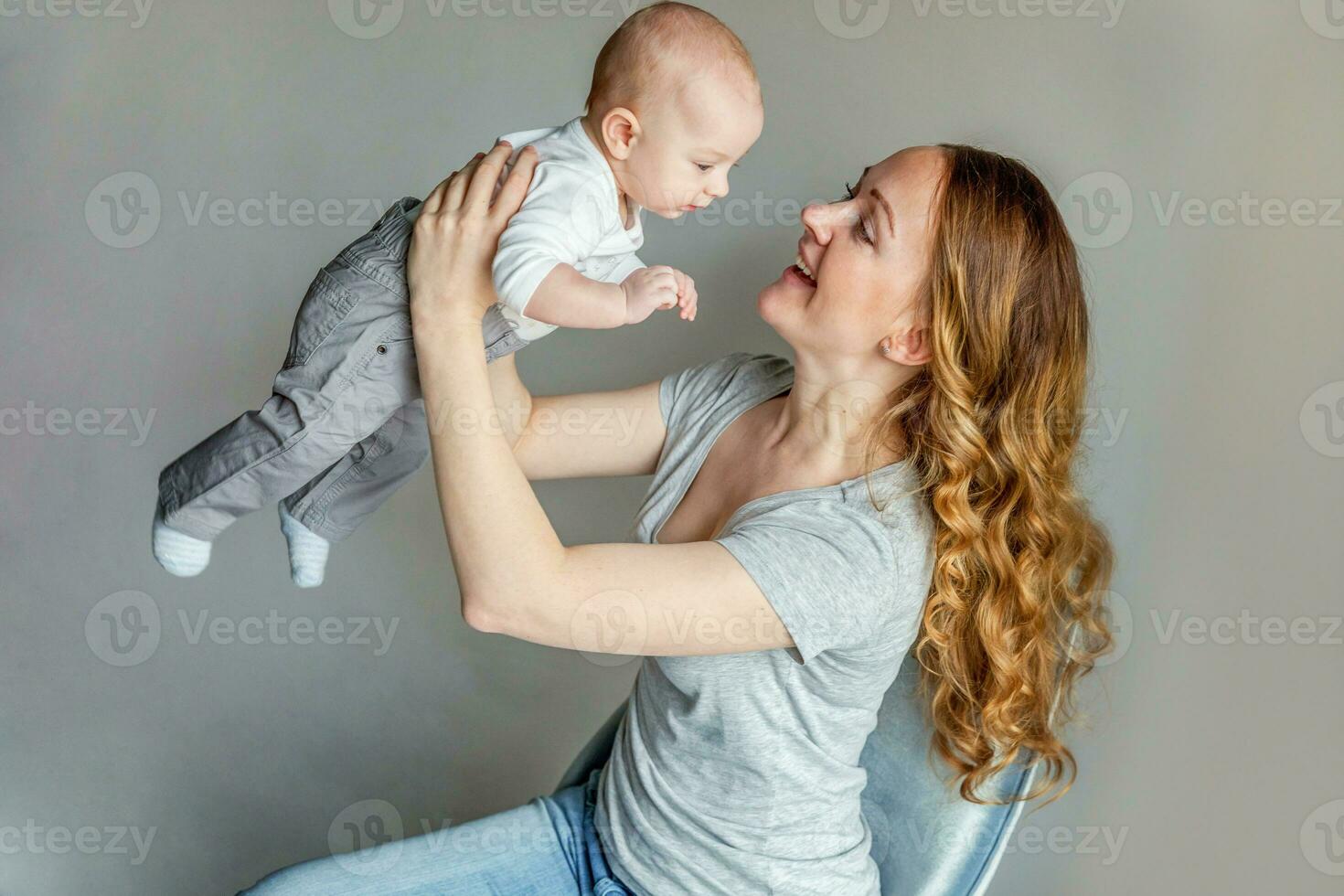 Young mother holding her newborn child photo