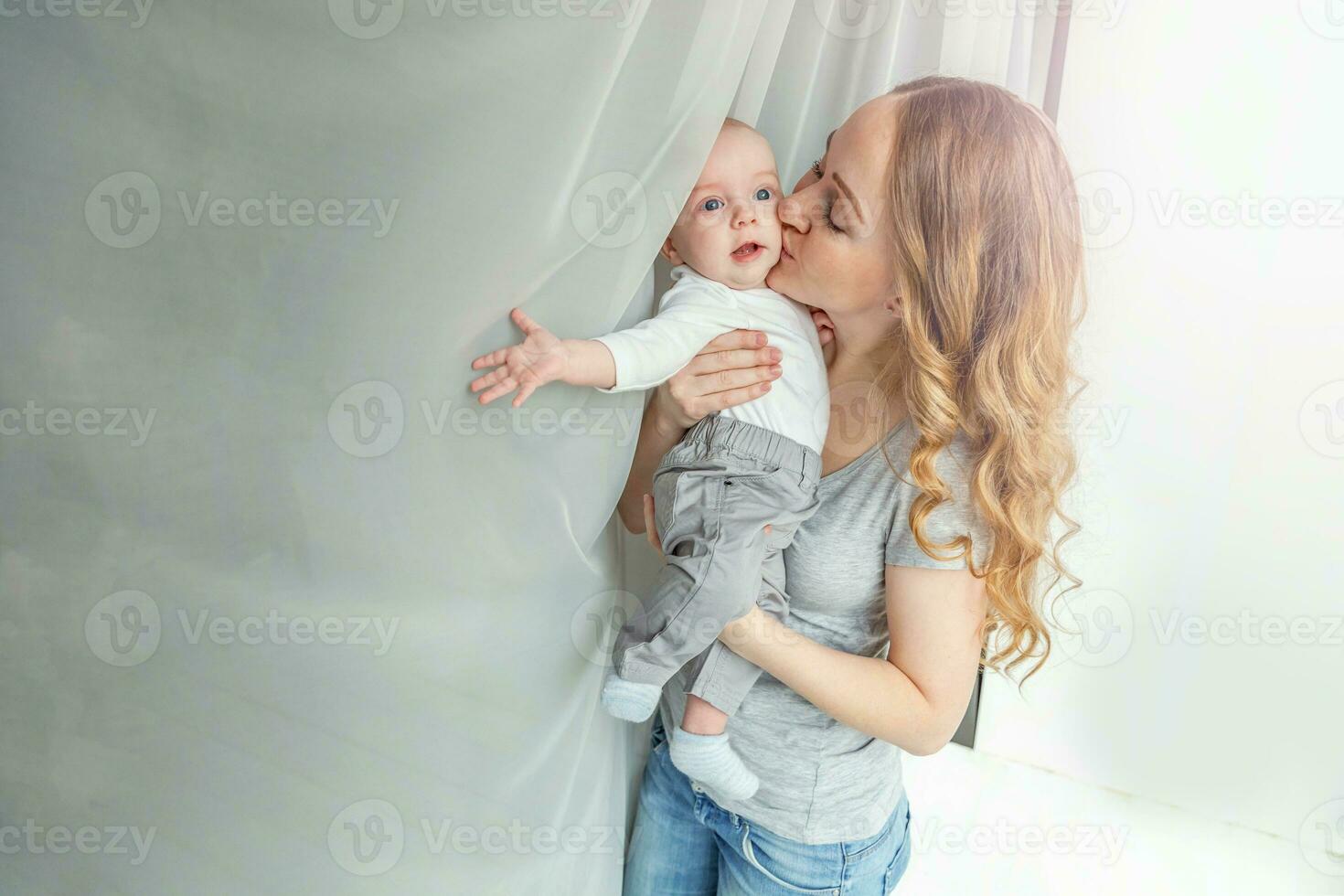 Young mother holding her newborn child photo