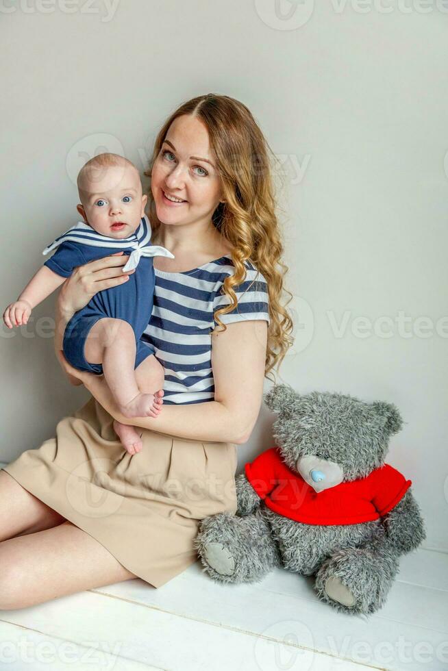 Young mother holding her newborn child photo