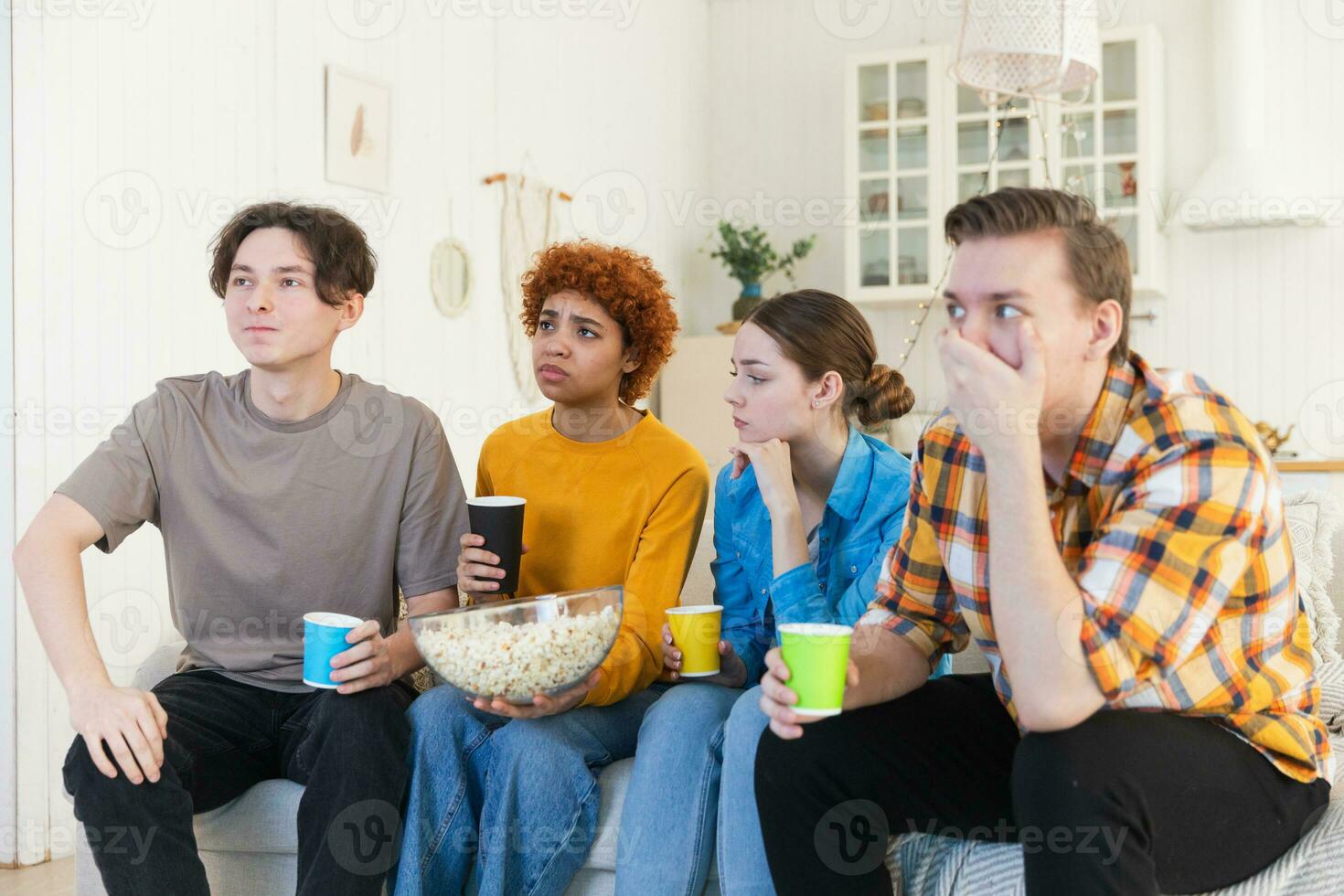 Group of friends watching sport match soccer football game on tv at home. Football fans disappointed missing goal loosing game. Friendship sports entertainment. Buddies watching championship together. photo